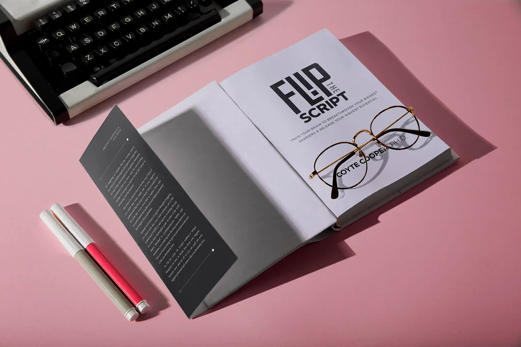 The dust jacket opened flat, showing the dark grey front flap alongside the cover panel.